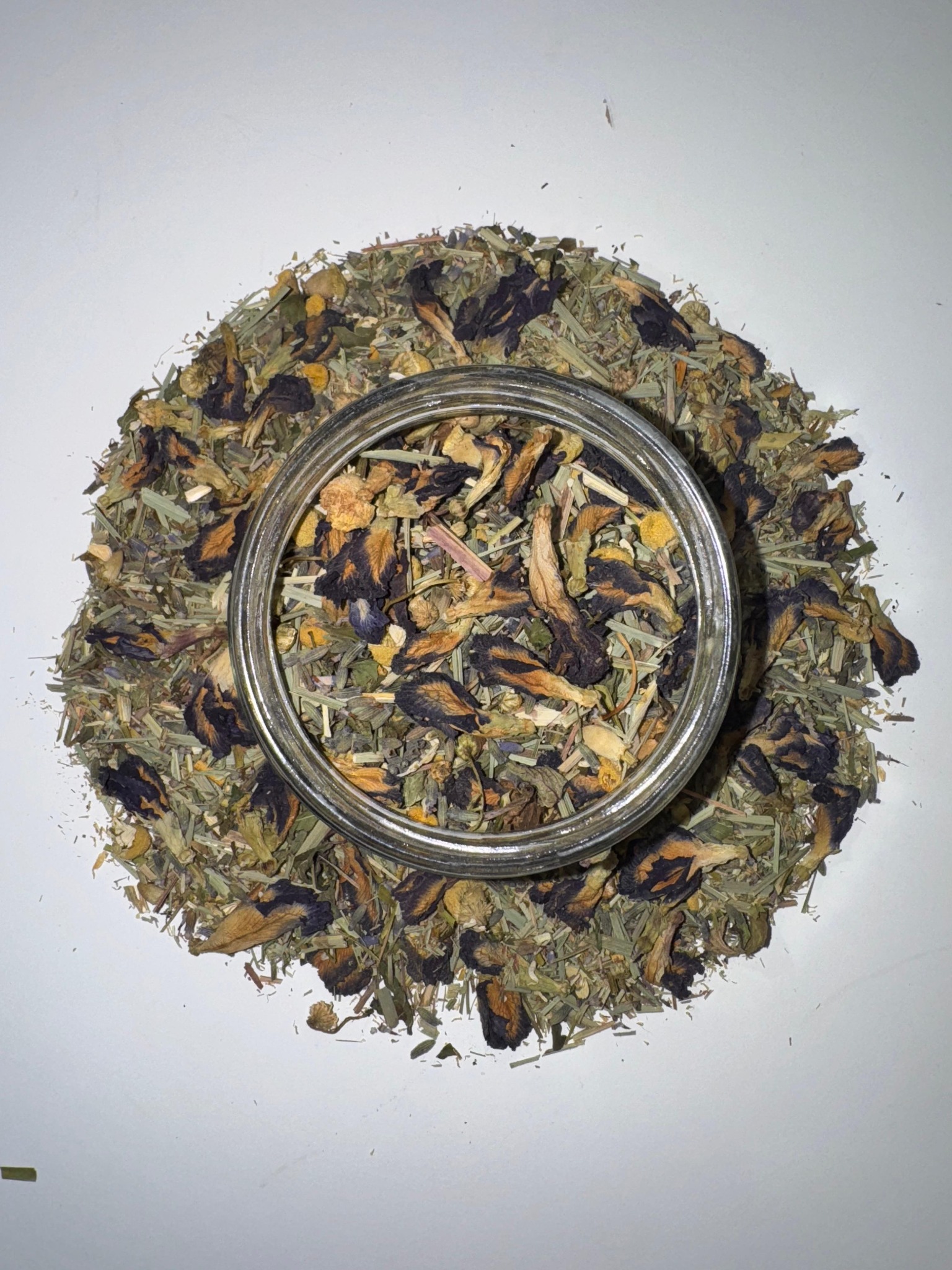 Mzuri tea blend with botanicals in a bowl