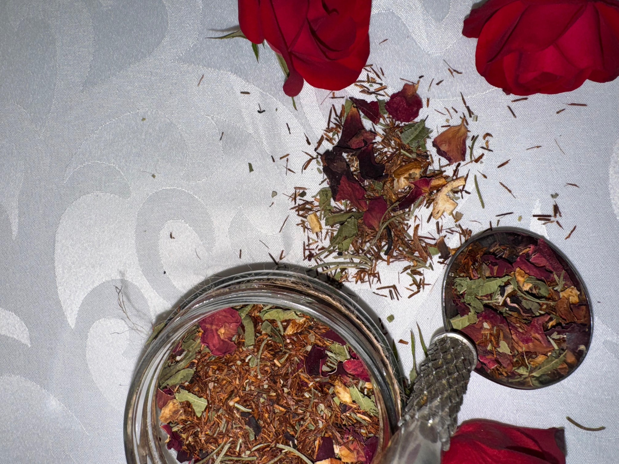 Mzuri tea jar with scattered ingredients
